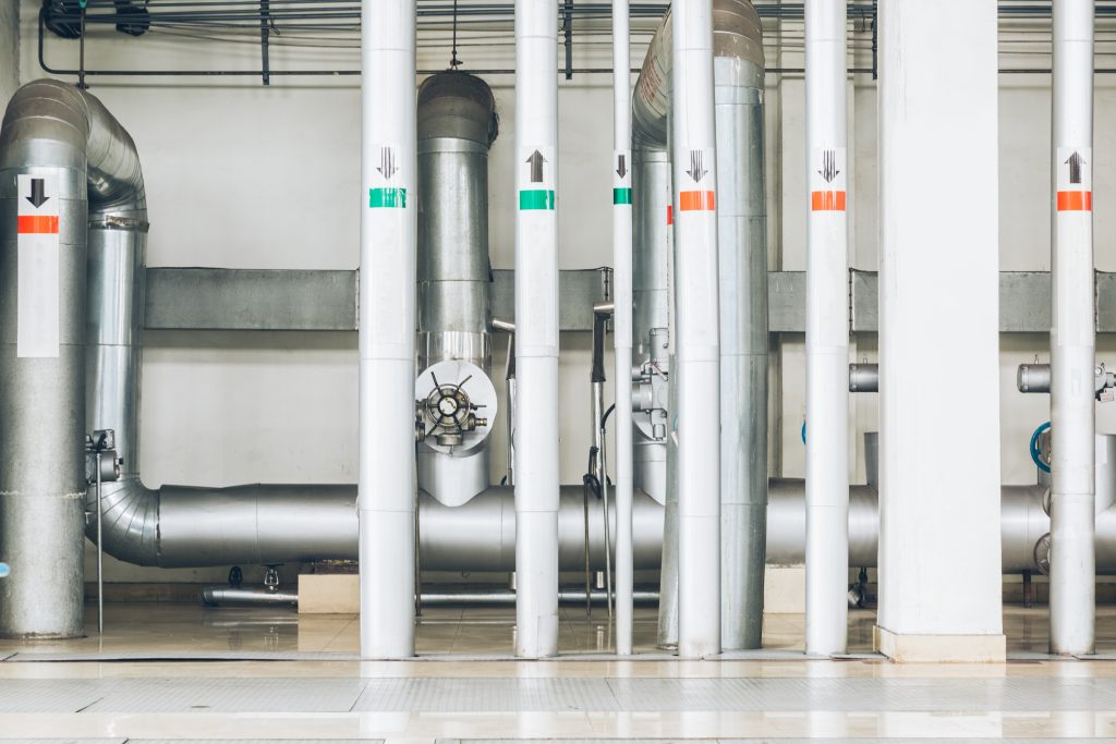 steel pipelines and cables in a plant,Industrial zone.