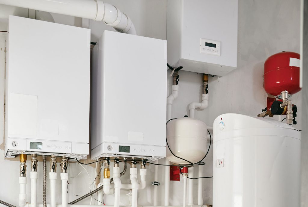 young-man-workwear-using-handtools-during-repairing-work-toilet